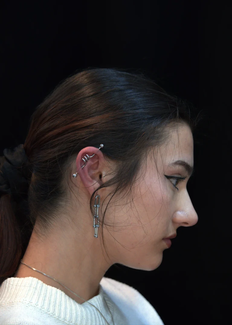 Industrial and multiple ear piercings with surgical steel jewelry at Tattoos1960 Pune