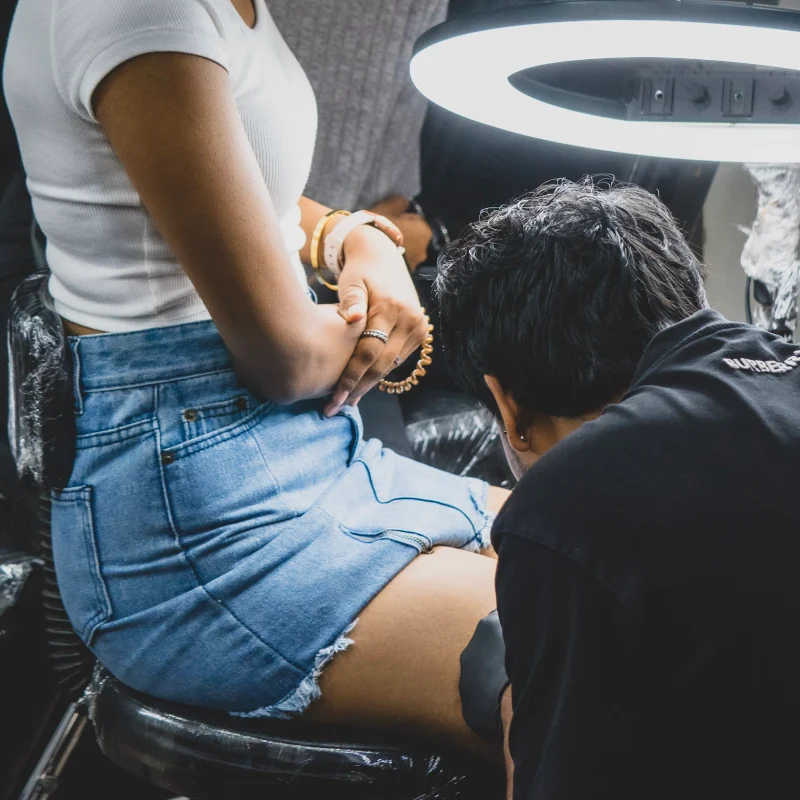 Professional Tattoo Designer Doing A Tattoo In Safe & Hygienic Tattoo Shop In Pune